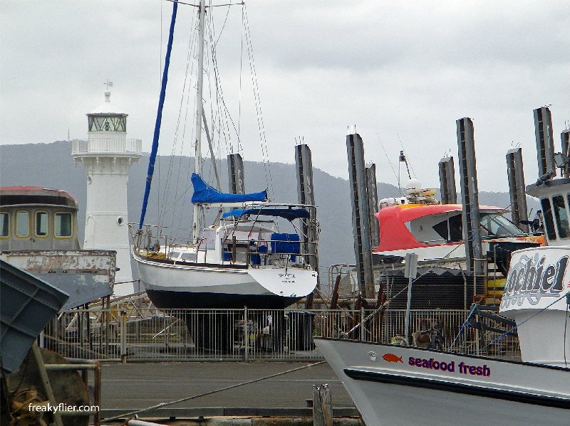 Fishing boats and yachts infront of the Breakwater (Old) Lighthouse, Wollongong Harbour