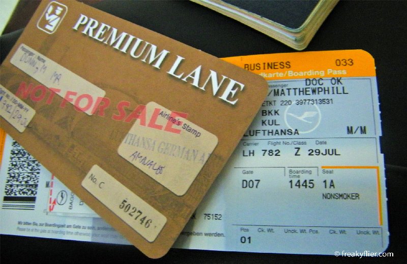 Business Class boarding pass and Premium Lane pass