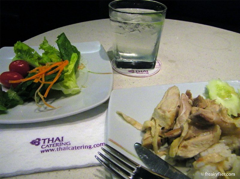 Hainanese chicken rice, salad and iced water with lime