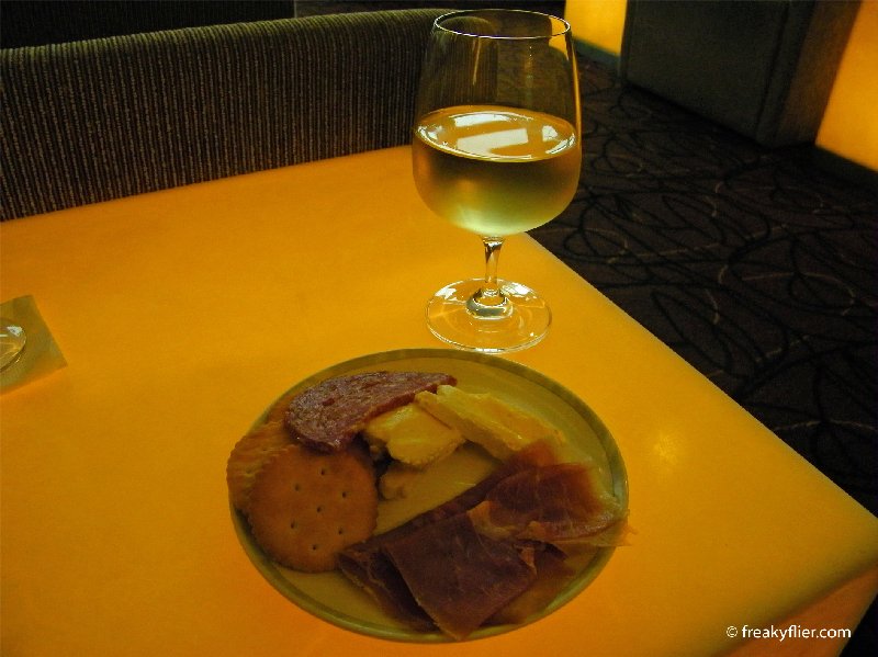 Charcuterie and cheeses with a white wine in the Singapore Airlines KrisLounge, Bangkok Airport