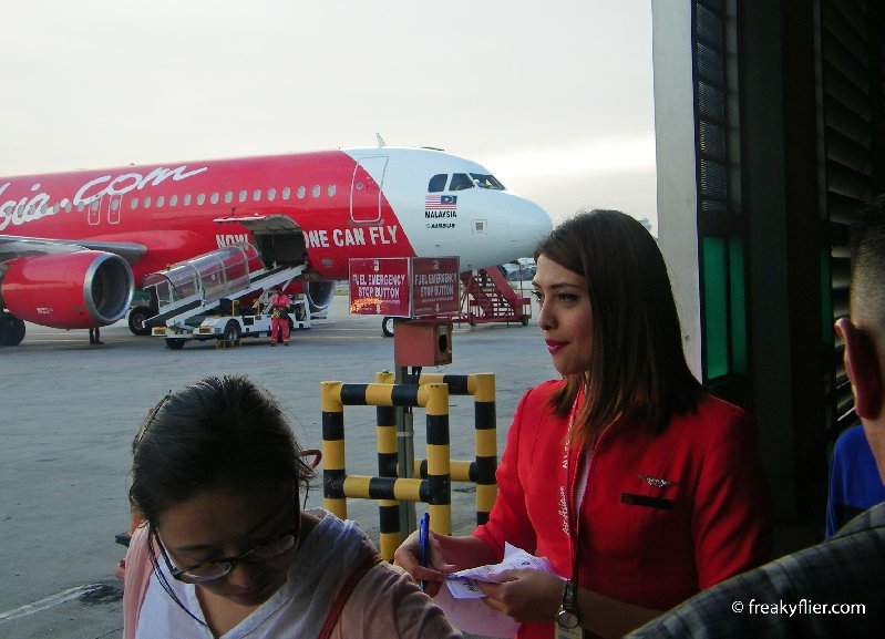 Boarding passes are checked at the entry to the tarmac prior to boarding the aircraft