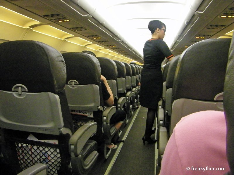 A sparse looking cabin from the rear of the aircraft