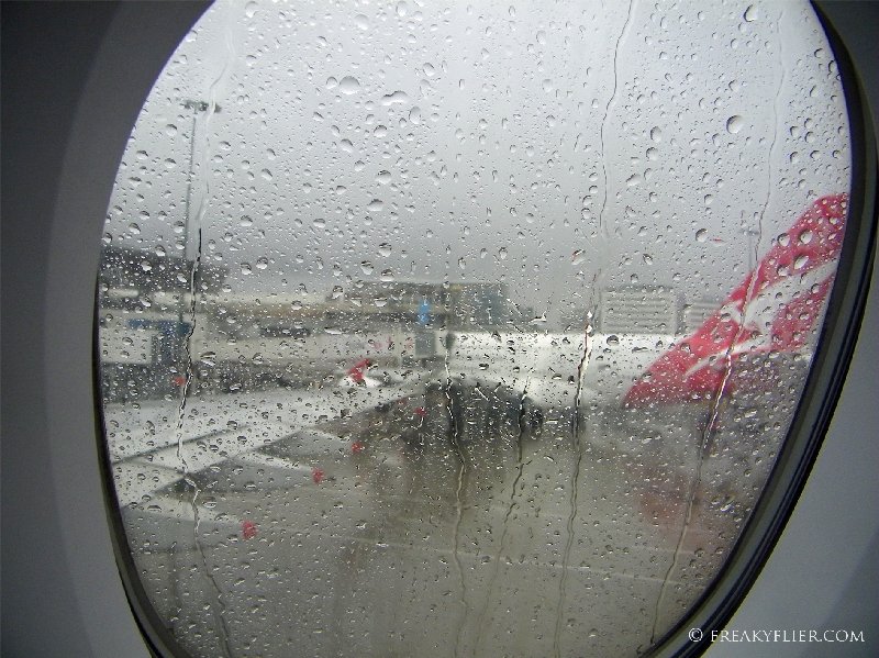 Arrival in a wet Sydney and parked next to a Qantas a380