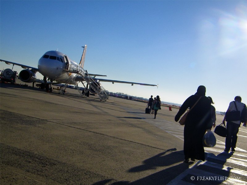 Walking across the tarmac to the awaiting aircraft
