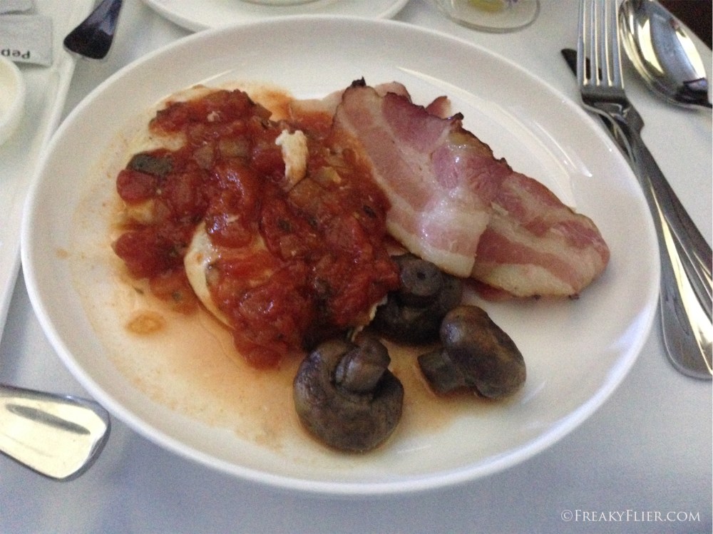 Baked egg with tomato ragout, mushroom and bacon