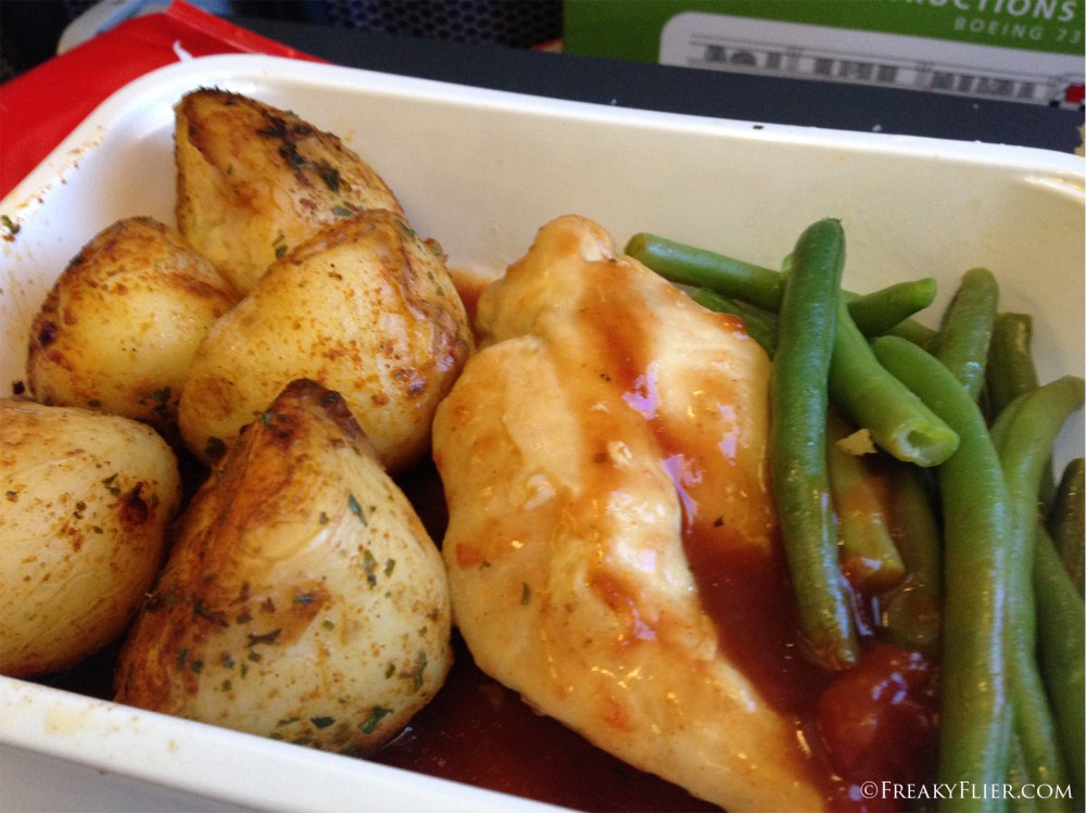 Roasted chicken, potatos and beans on board Qantas to Sydney