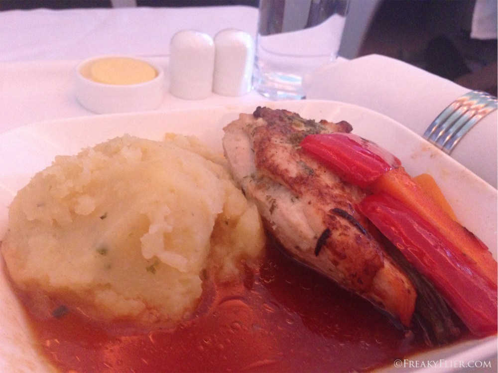 Grilled chicken with herbbed butter and chicken jus lie served with sauteed vegetable